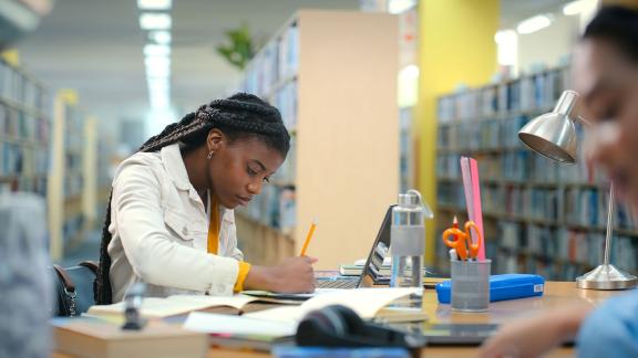 Student studying in a library