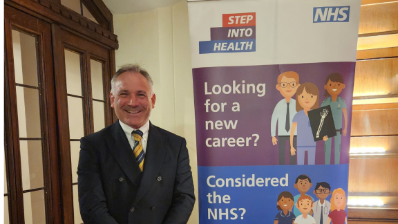 An image of Dan Brooks next to a step into health banner