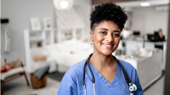 A BME nurse on a hospital ward smiling