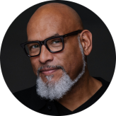 Headshot of John Amaechi