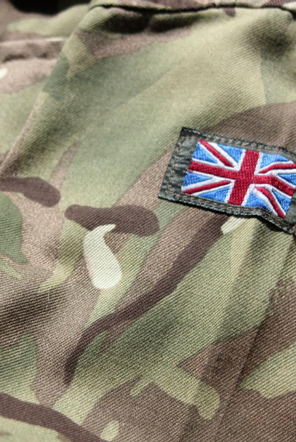 A close up of the British Army uniform, with a UK flag sewn on.