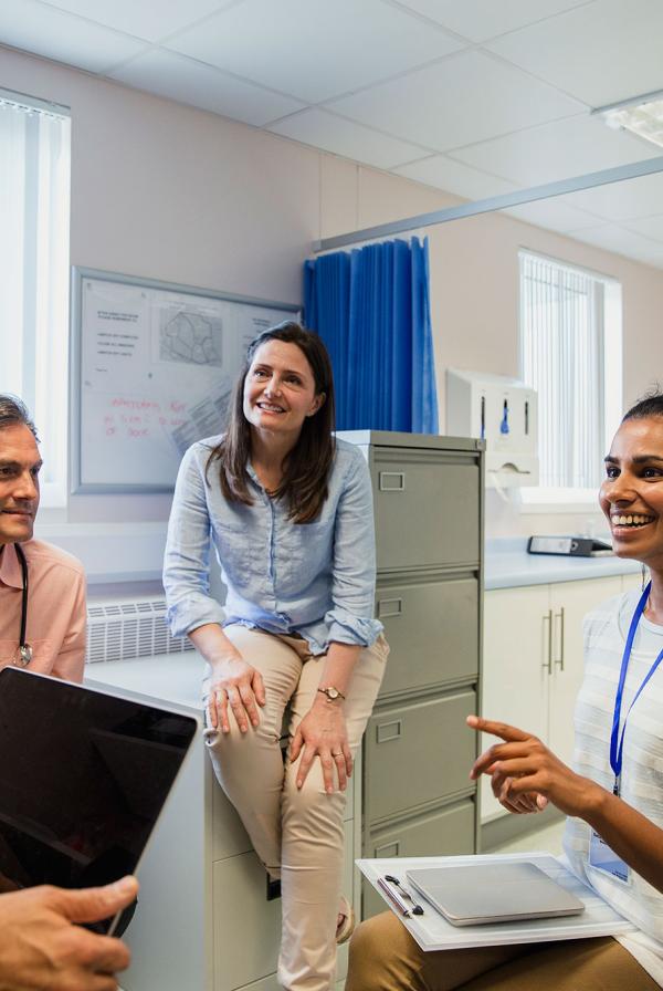 A diverse group of healthcare professionals in a meeting.