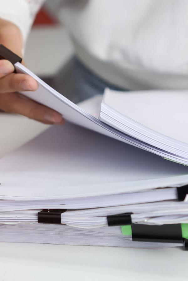 An office worker sorting through files.