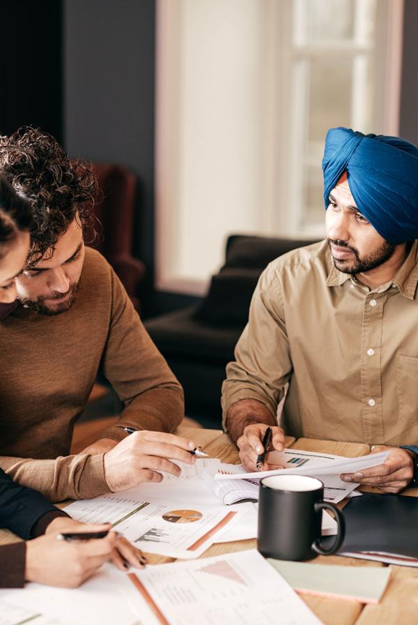 A diverse team meeting around a table.