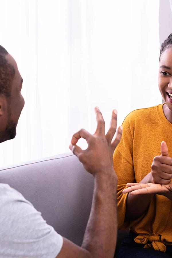 Two people having a sign language conversation.