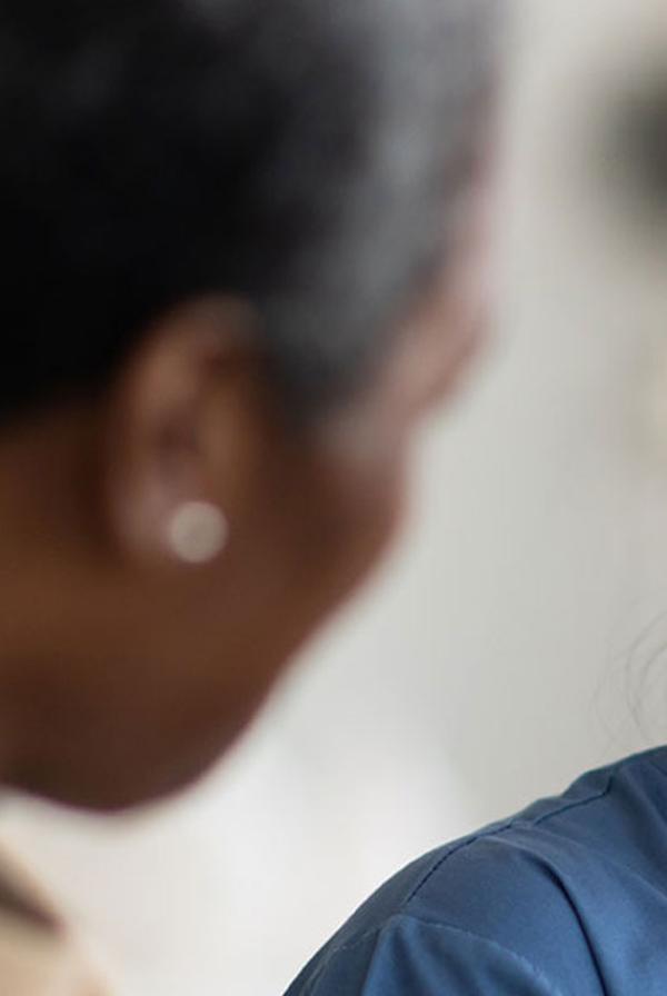 A doctor smiling at a patient.