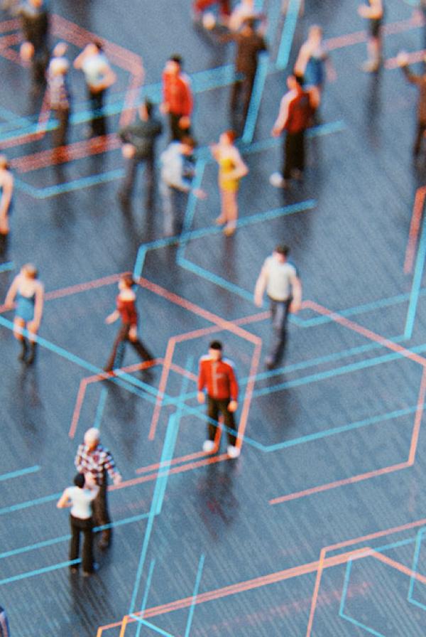 Model figures of people standing around with a matrix of lines connecting them.