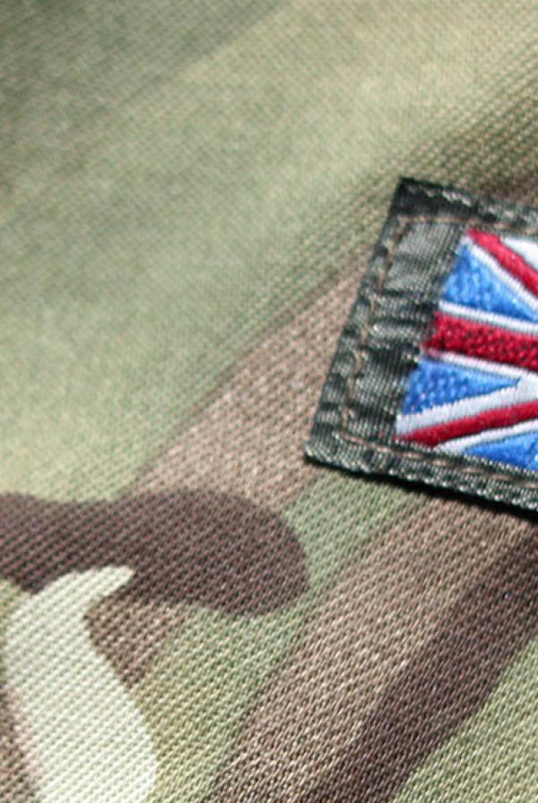 A close up of the British Army uniform, with a UK flag sewn on.