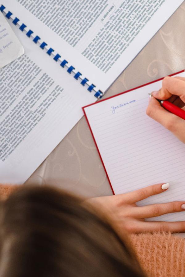 A person writing notes.